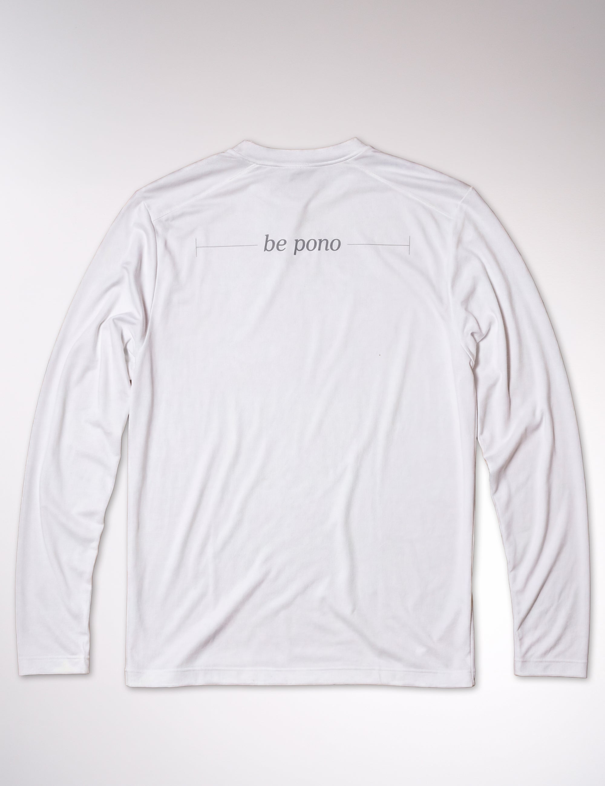 White long-sleeve shirt with 'be pono' text on a light gray background