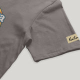 Gray t-shirt with a kailua hi logo on a light gray background