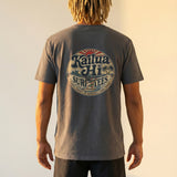 Person wearing a gray t-shirt with 'Kailua Hi Surf Tees' logo on the back, standing against a plain background.