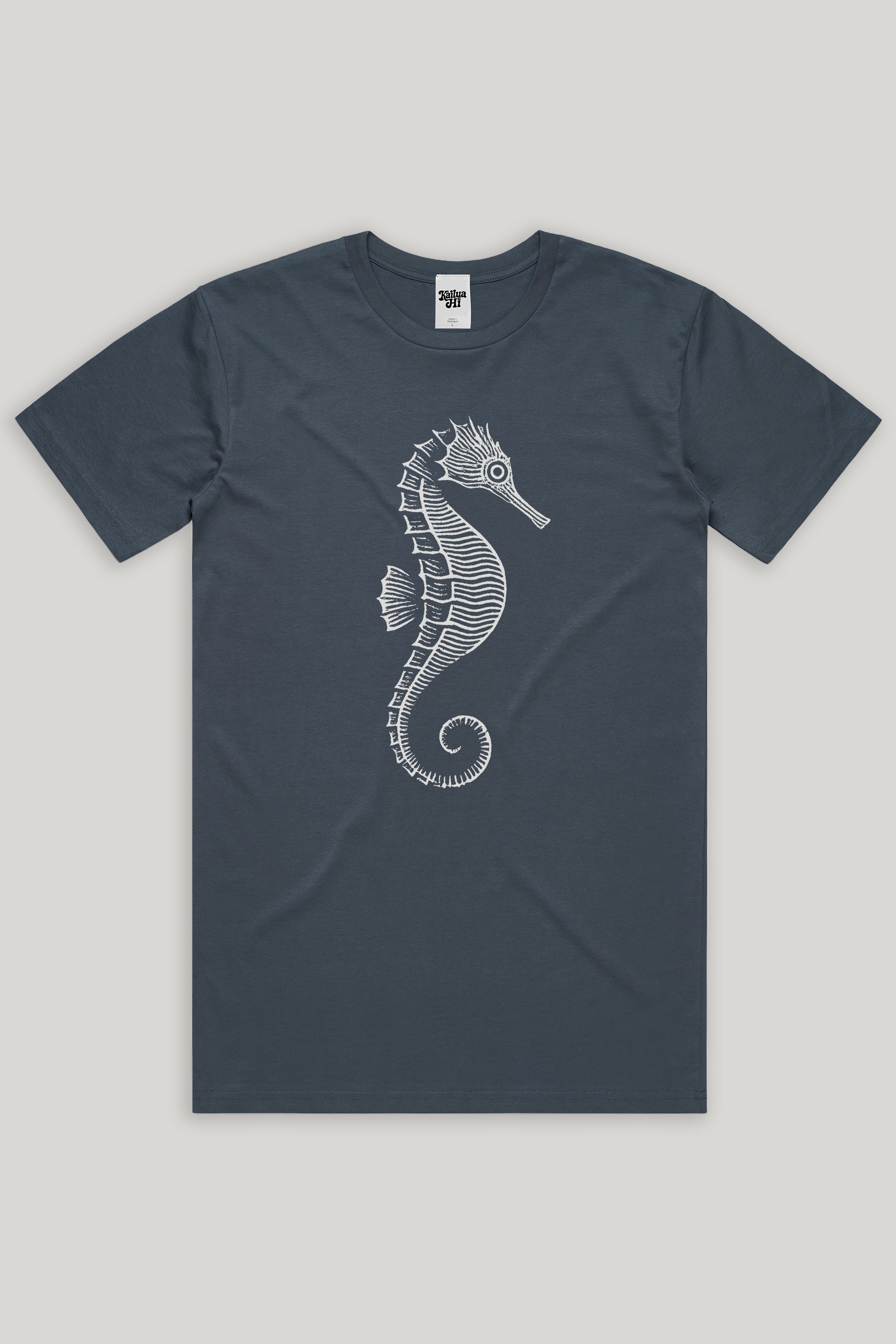 grey-ish blue t-shirt with a white seahorse design on a light gray background