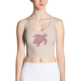 front view of light-rose, body-hugging crop top with centered burgundy honu turtle motif