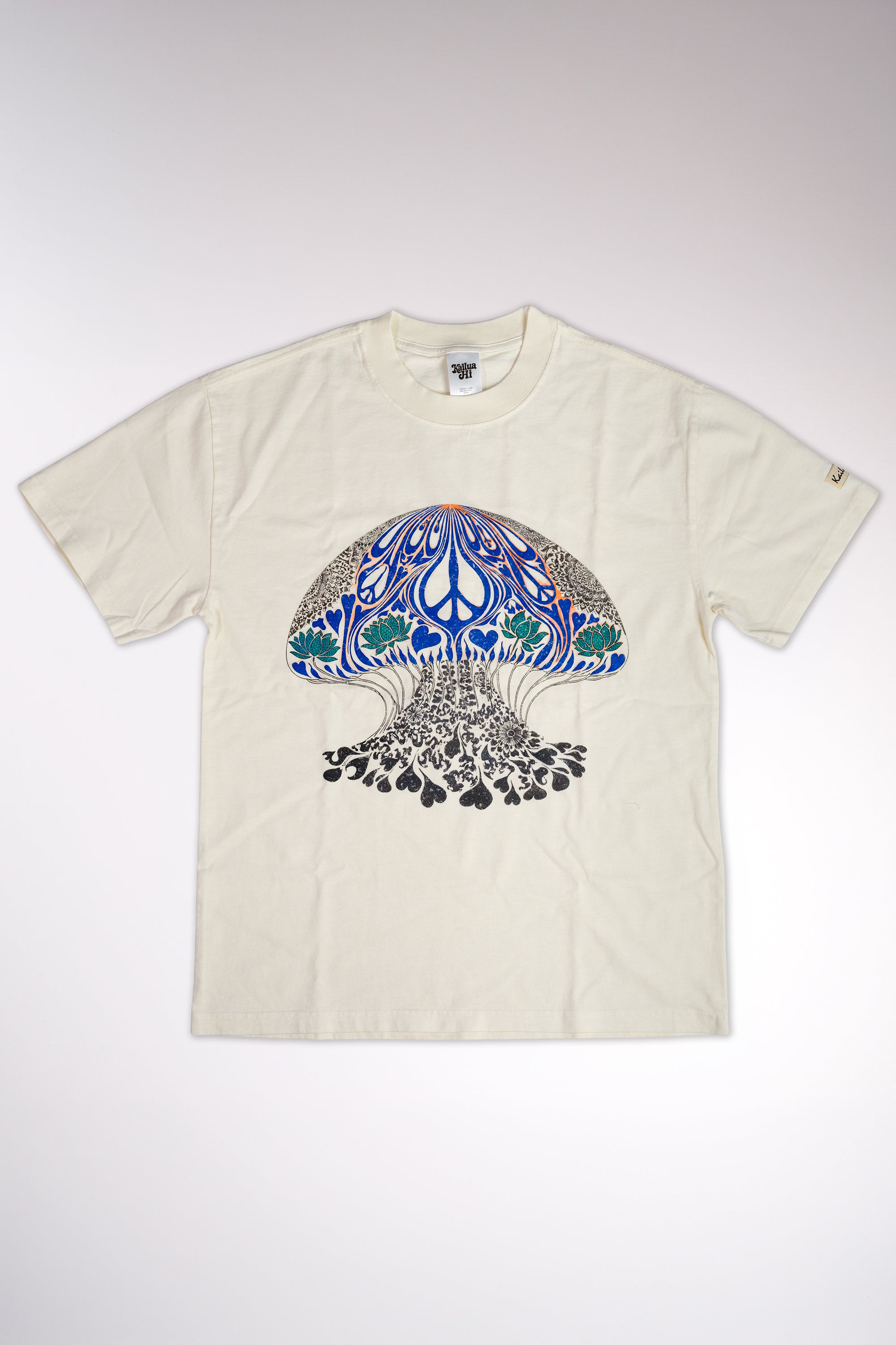 kailua hi surf tees psychedelic moon jelly luxe women's tee in faded ecru – studio flat lay product shot showing the full front graphic design, relaxed crew neckline, interior kailua hi woven neck label, and sleeve tag against a neutral background