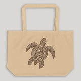 Beige tote bag with a turtle design on a light gray background