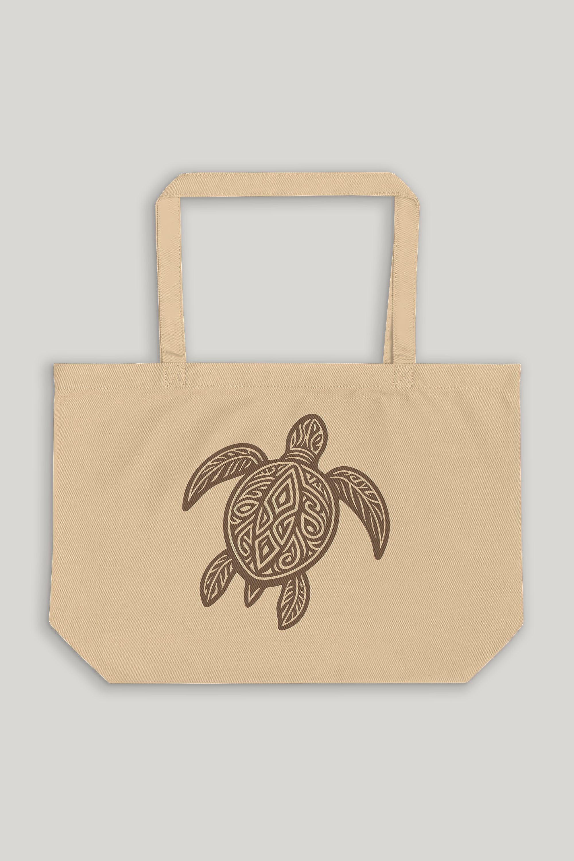 Beige tote bag with a turtle design on a light gray background