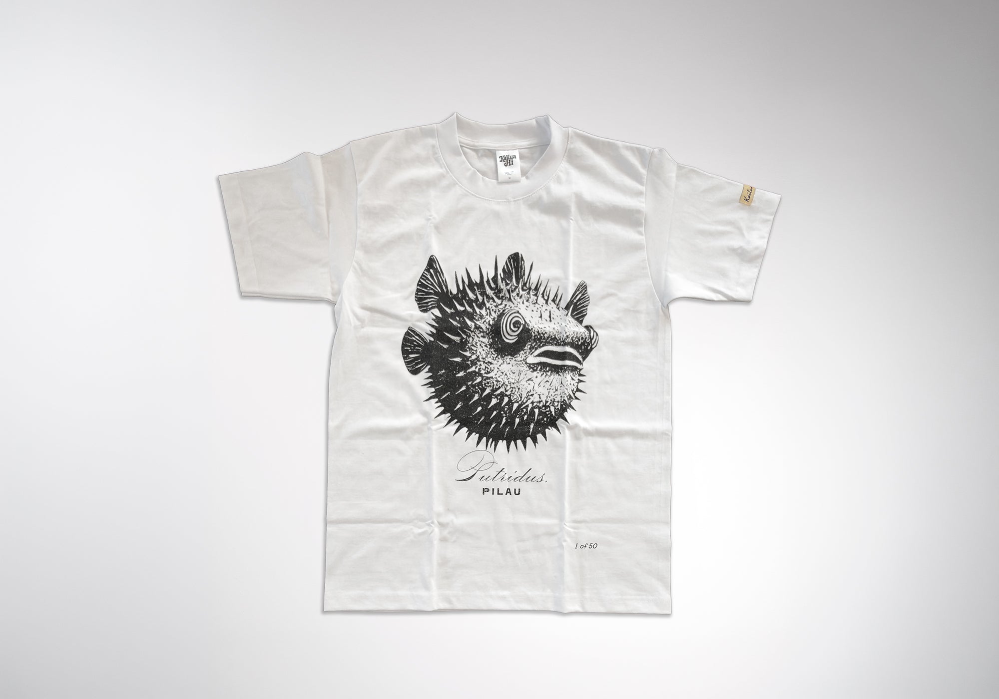 White t-shirt with black puffer fish graphic and text on a white background