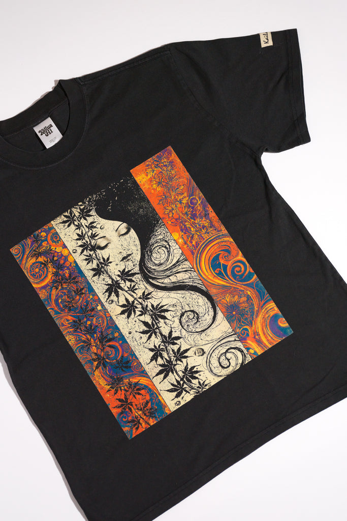 kailua hi surf tees seaweed pua o ke kai women's luxe tee in faded black – product lifestyle video showcasing the relaxed casual fit, premium fabric drape, and detailed art nouveau graphic panel featuring a woman's face and vibrant botanical leaves in motion