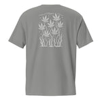 back view flat lay of grey garment-dyed pocket tee with centered off-white sea-weed leaf panel between the shoulders
