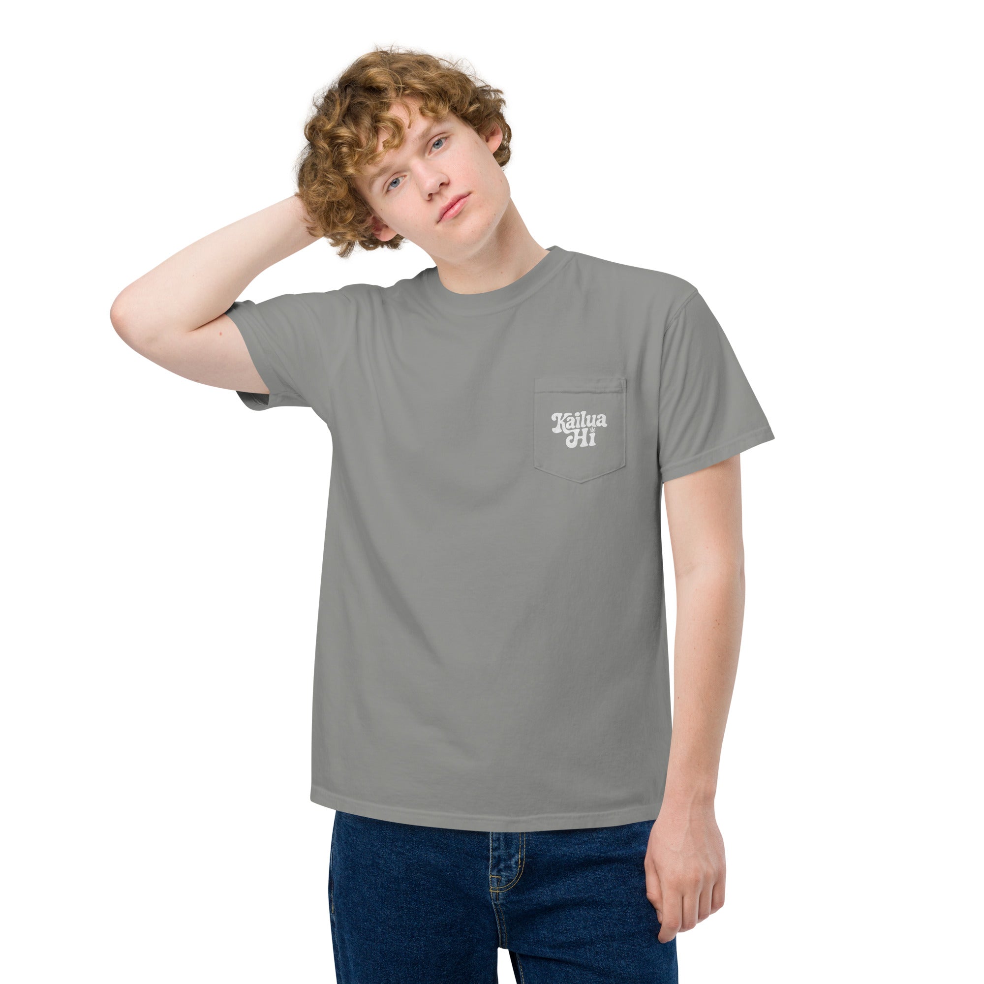 front three-quarter view of grey garment-dyed tee with chest pocket and small kailua hi logo; relaxed fit